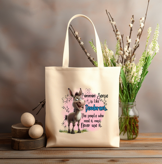 COMMON SENSE is like DEODORANT 12x14 canvas tote bag